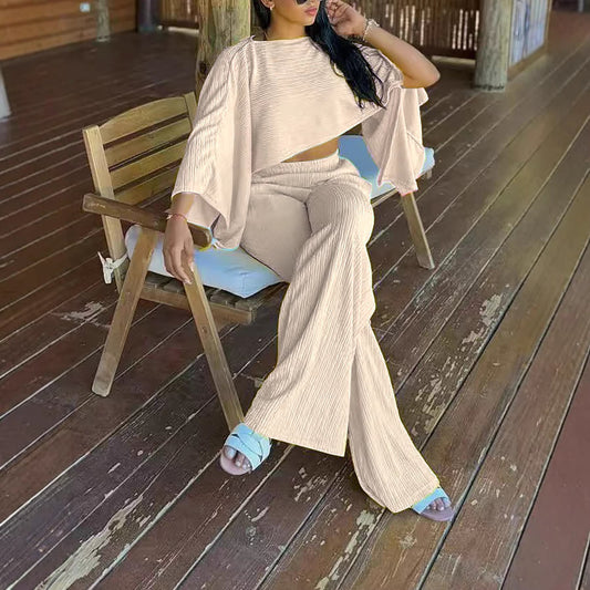 Solid-color Off-shoulder Top With An Asymmetrical Neckline, Paired With Elastic-waist Pants Featuring Pockets